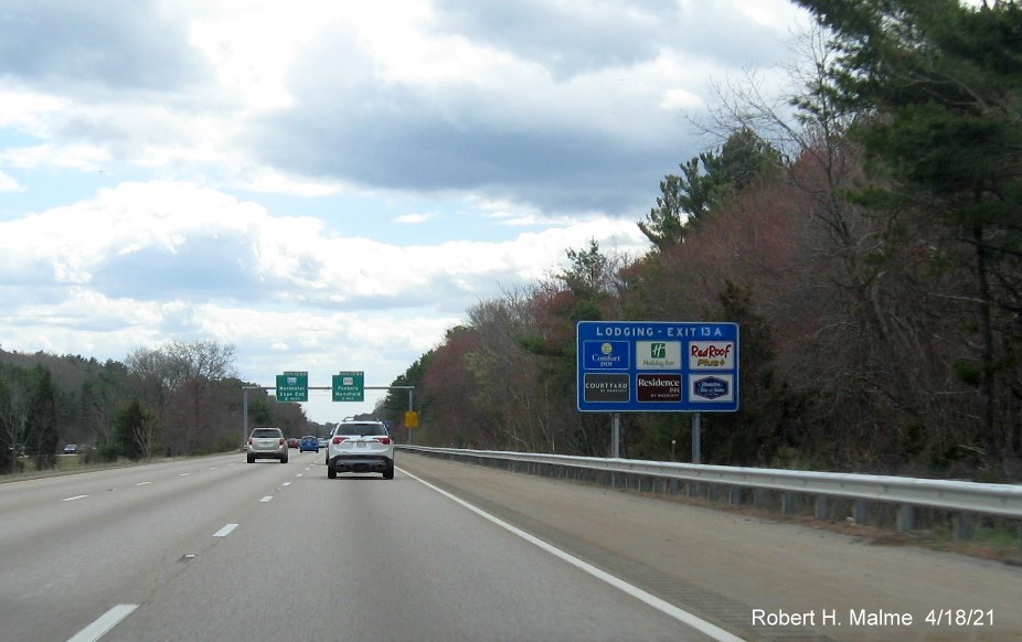 Image of blue Food Services sign for MA 140 exits with new milepost based exit numbers on I-95 South in Foxboro, April 2021