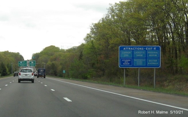 Image of blue Attractions sign for MA 123 exit with new milepost based exit number on I-95 North in Attleboro, May 2021