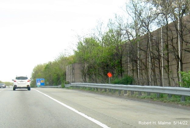 Image of contractor future sign placement tag and concrete foundation for new sign on I-95/MA 128 North in Wakefield, May 2022