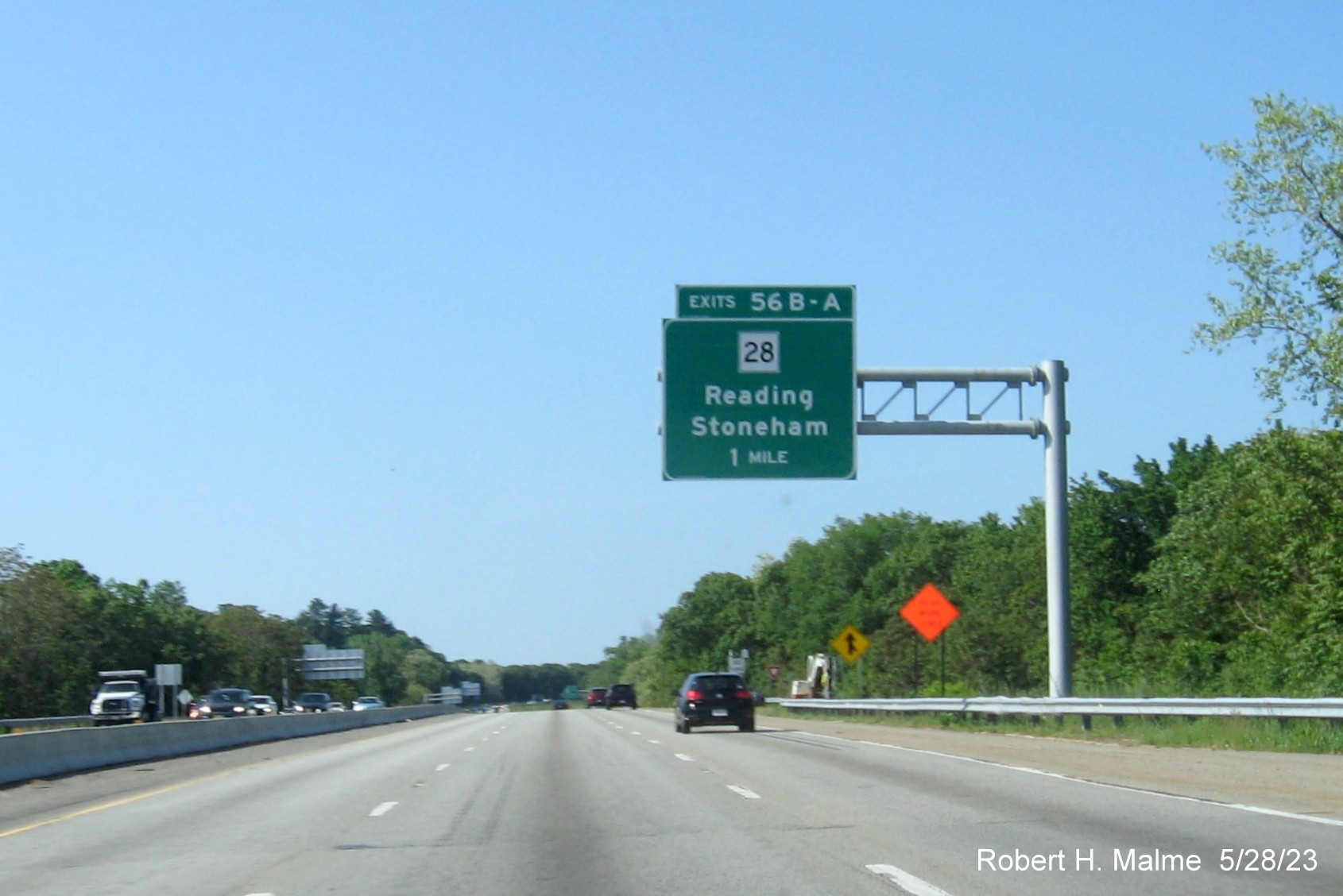 Image of recently placed 1 mile advance overhead sign for MA 28 exit on I-95 South in Reading, May 2023