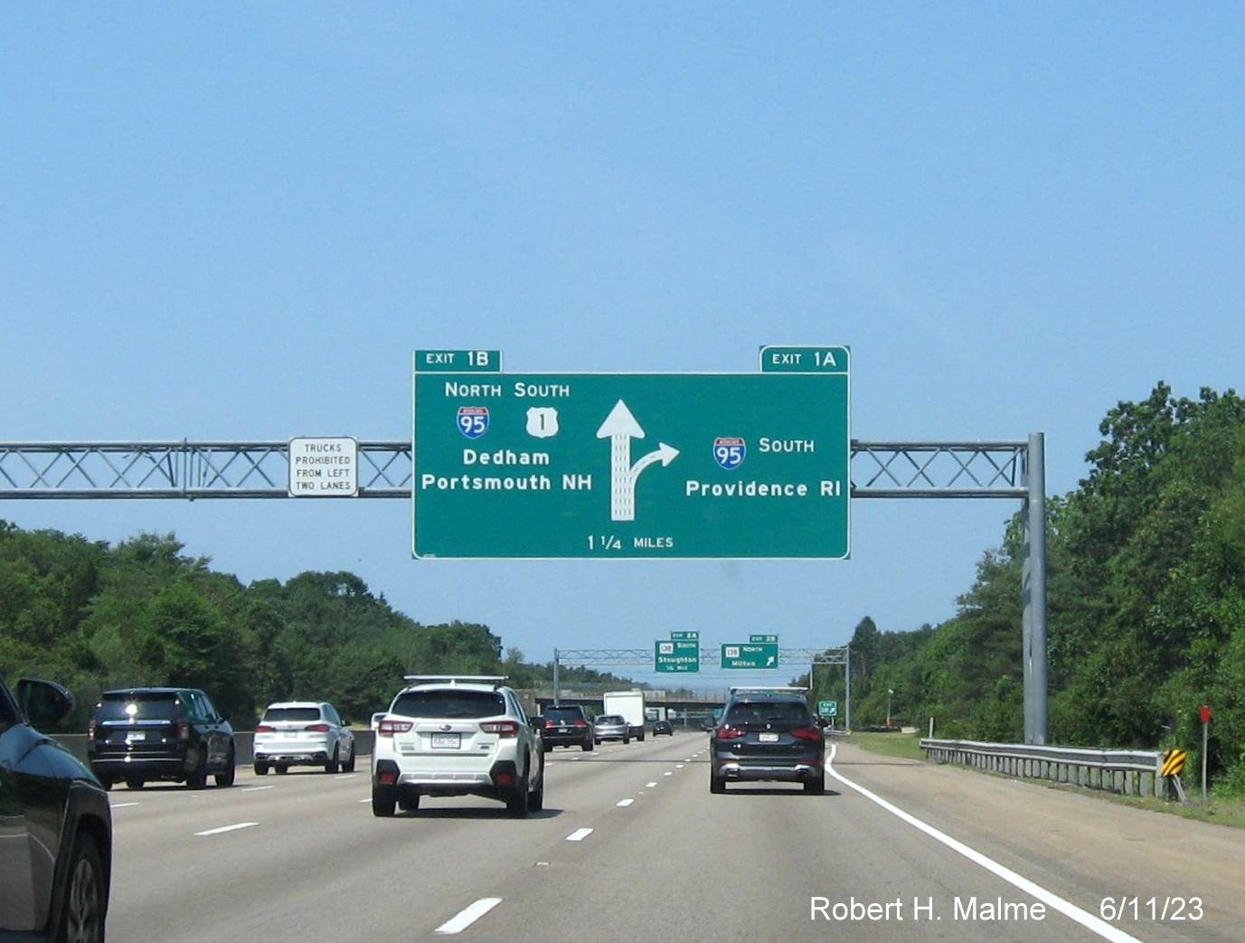 Image of 1 mile advance diagrammatic sign with yellow Left Exit tab removed on left side on I-93/US 1 South in Canton, June 2023