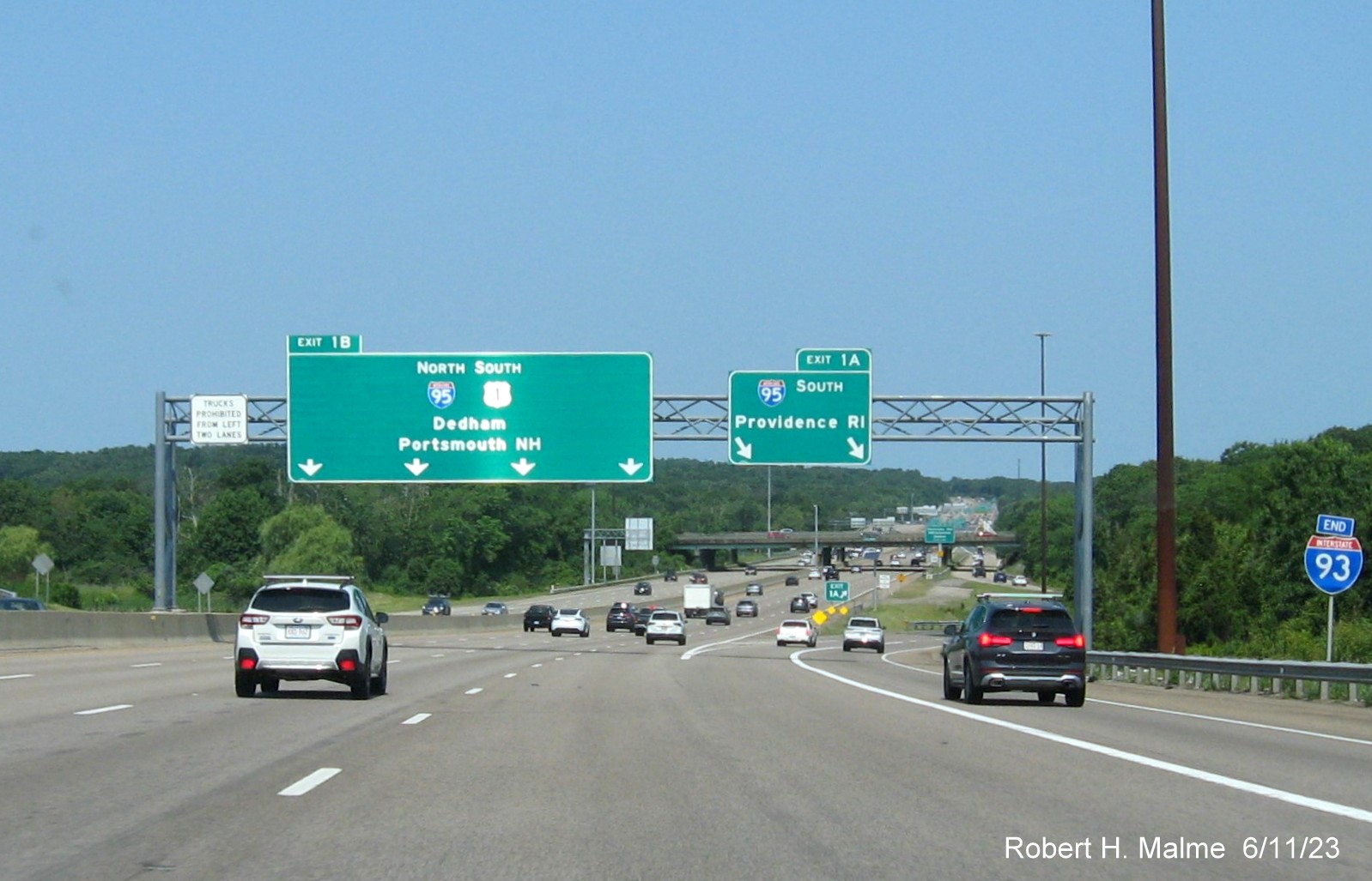 Image of overhead signs at ramp for I-95 South exit with yellow Left Exit tab removed on left sign on I-93/US 1 South in Canton, June 2023
