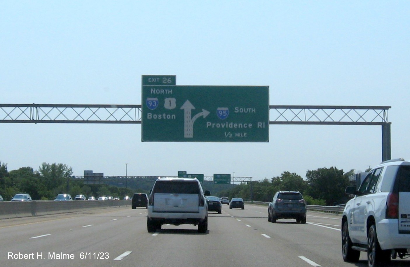 Image of 1/2 mile advance diagrammatic sign with yellow Left Exit tab removed on left side on I-95 South/US 1 North in Canton, June 2023