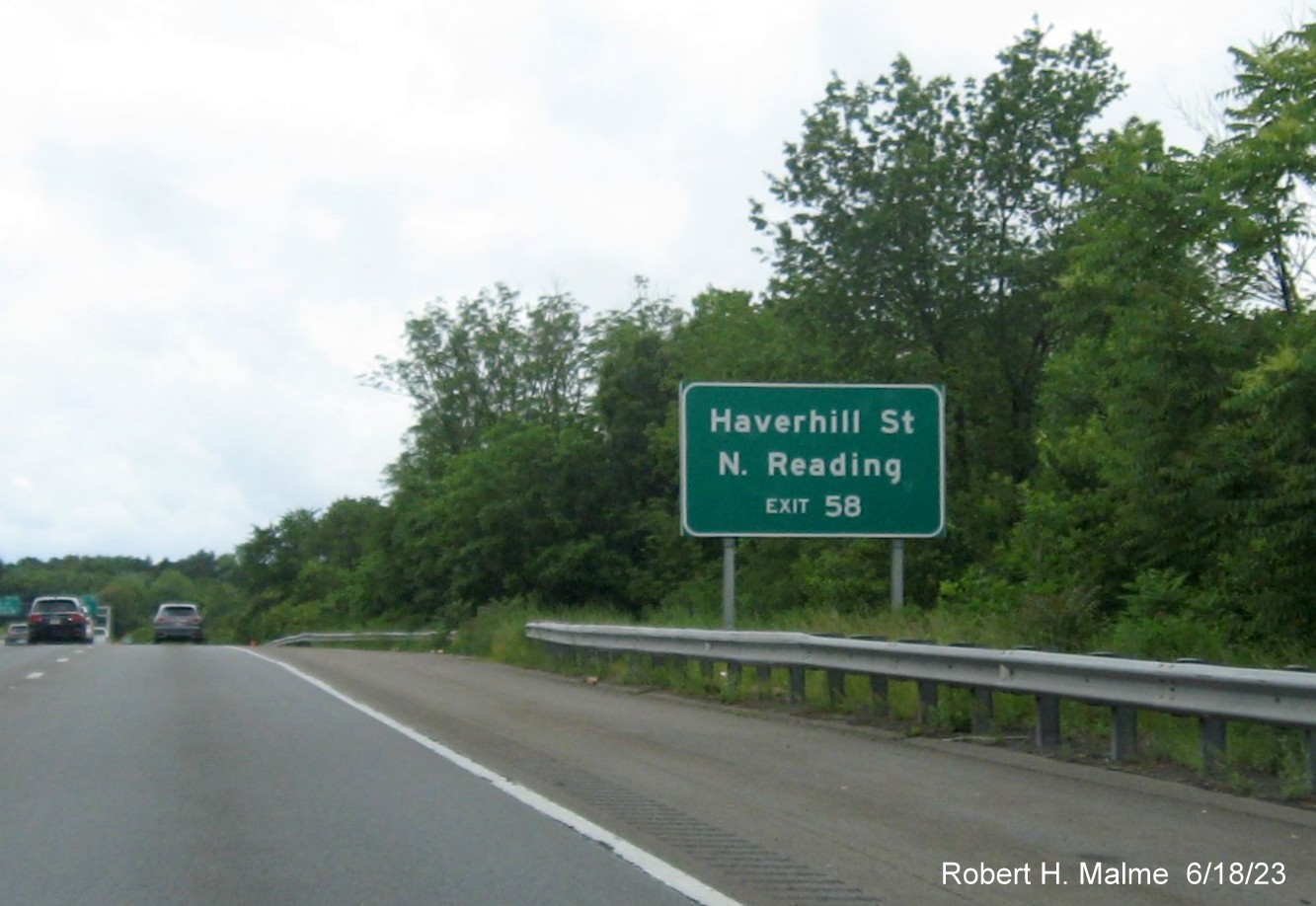 Image of recently placed auxiliary sign for MA 129 exit on I-95/MA 128 South in Wakefield, June 2023
