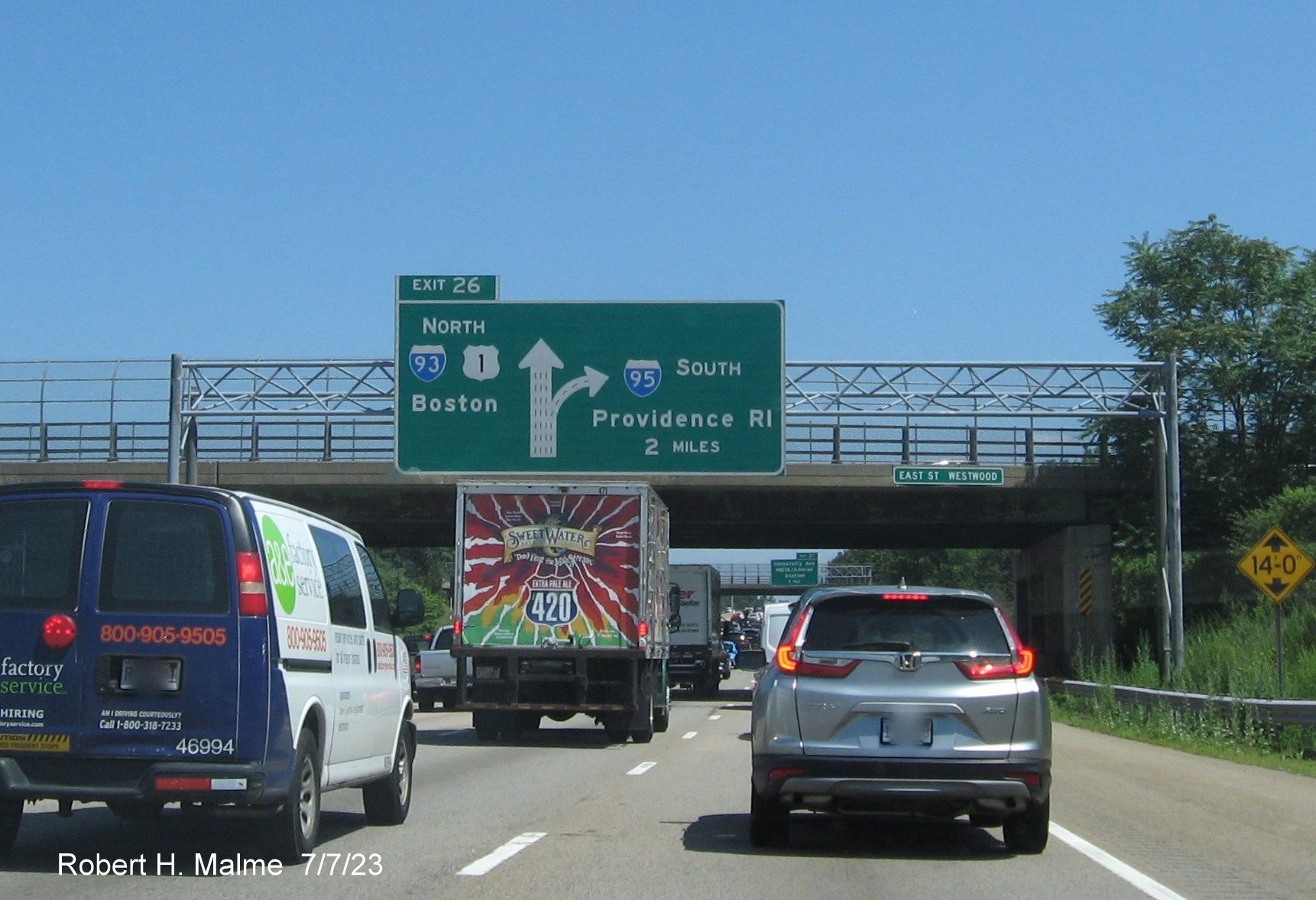 Image of 2 miles advance overhead diagrammatic sign for I-93/US 1 North exit with yellow Left Exit tab removed on I-95/MA 128 South in Westwood, July 2023