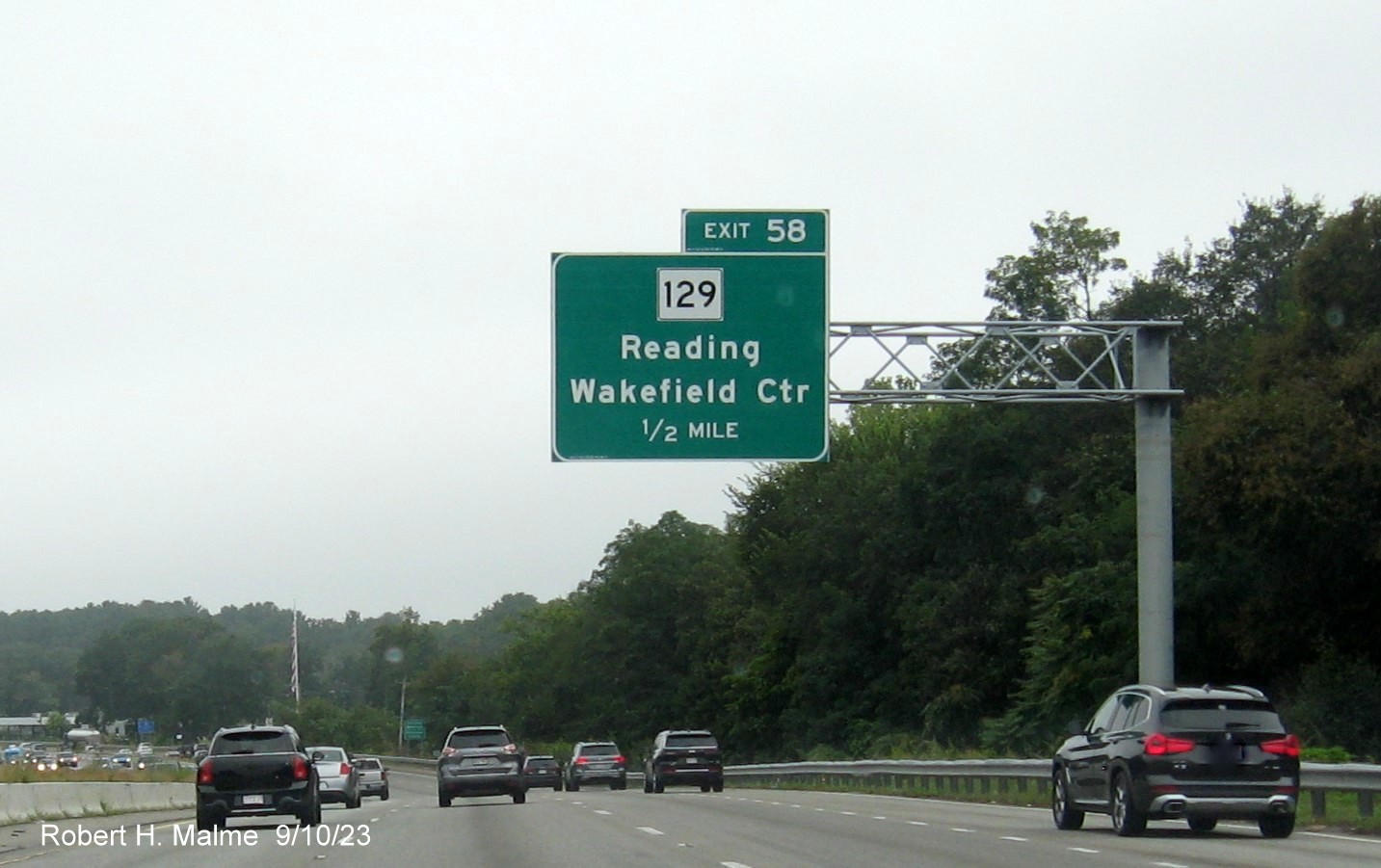 Image of recently placed 1/2 mile advance sign for the MA 129 exit on I-95/MA 128 South in Wakefield, September 2023