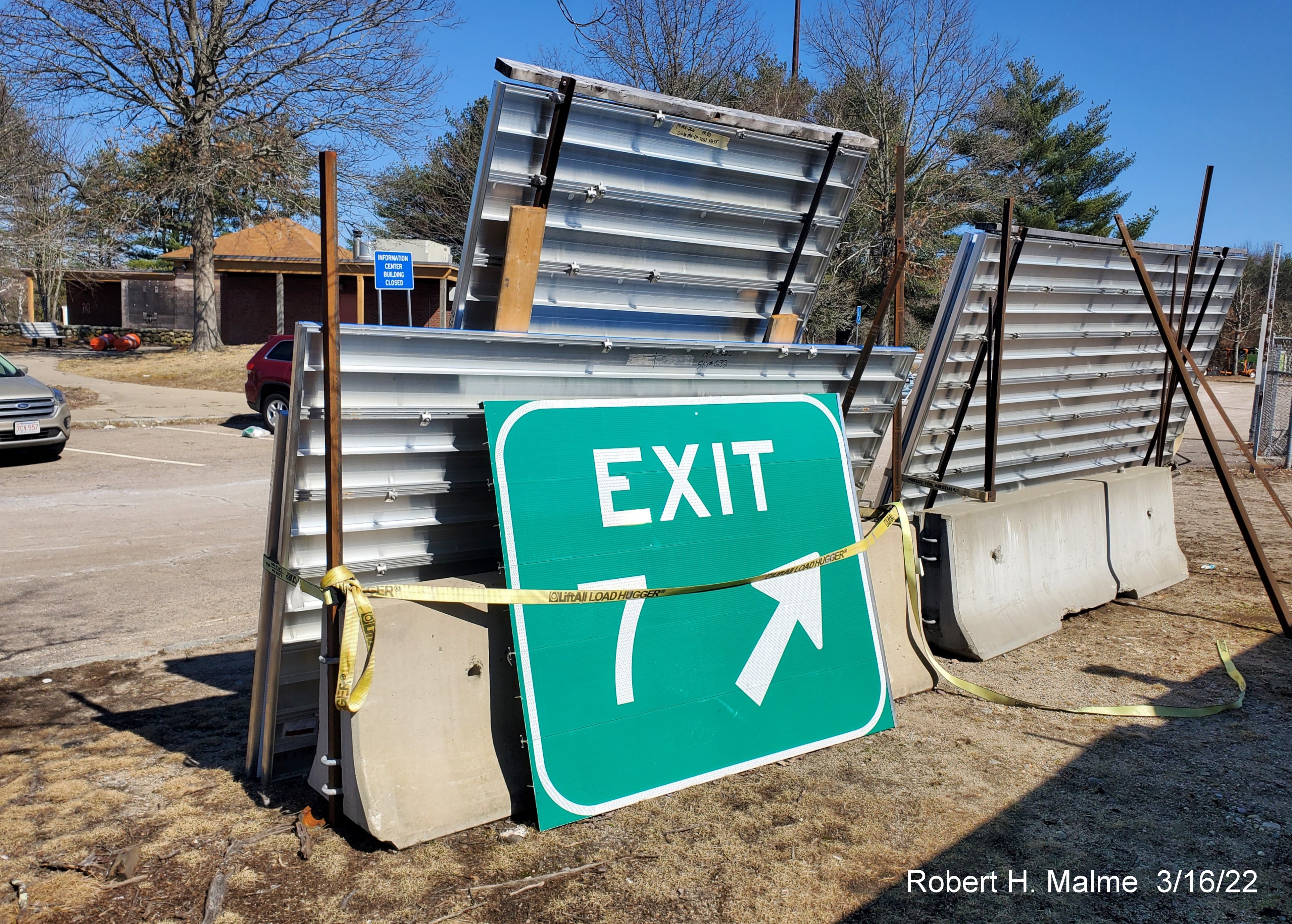 Image of a ground mounted gore sign for To MA 152 exit being stored at Mansfield Rest Area, March 2022