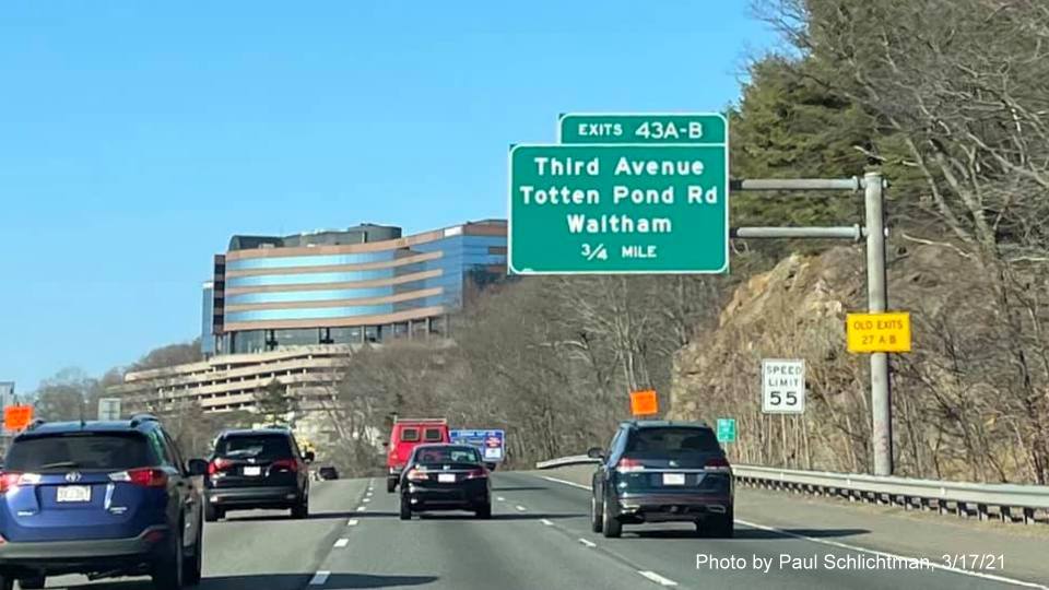 Image of 1-Mile advance overhead sign for Third Avenue/Totten Pond Road exits with new milepost based exit numbers and yellow Old Exits 27 A-B advisory sign on support on I-95/MA 128 North in Waltham, by Paul Schlichtman, March 2021