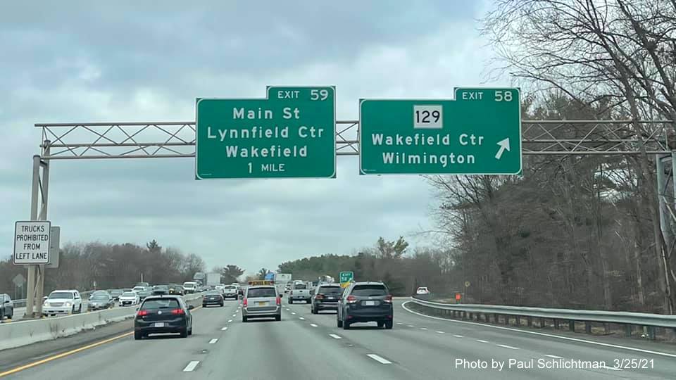 Image of overhead signage at ramp for Main Street exit with new milepost based exit number on I-95/MA 128 North in Lynnfield, by Paul Schlichtman, March 2021