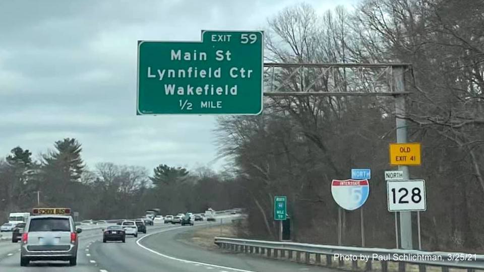 Image of 1/2 mile advance overhead sign for Main Street exit with new milepost based exit number and yellow Old Exit 41 advisory sign on support on I-95/MA 128 North in Lynnfield, by Paul Schlichtman, March 2021