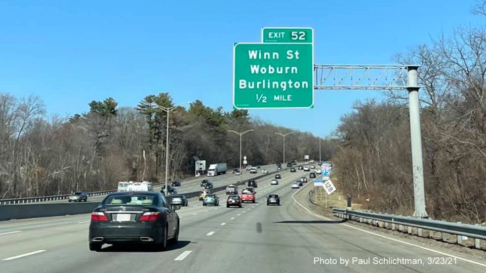 Image of 1/2 mile advance overhead sign for Winn Street exit with new milepost based exit number on I-95/MA 128 North in Woburn, by Paul Schlichtman, March 2021