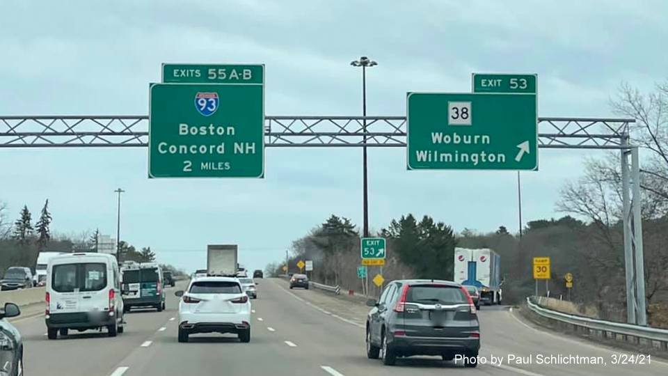 Image of overhead ramp sign for MA 38 exit with new milepost based exit number on I-95/MA 128 North in Woburn, by Paul Schlichtman, March 2021