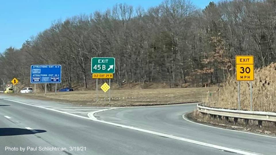 Image of auxiliary sign for MA 2 exits with new milepost based exit numbers on I-95/MA 128 North in Lexington, photo by Paul Schlictman, March 2021