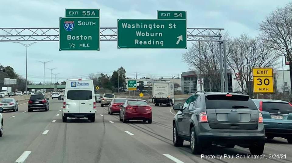 Image of overhead ramp sign for Washington Street exit with new milepost based exit number on I-95/MA 128 North in Woburn, by Paul Schlichtman, March 2021