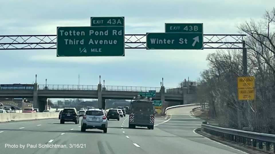Image of overhead ramps signs at the Winter Street exit with new milepost based exit number and yellow Old Exit 27 B-A signs on right support on I-95/MA 128 South in Lexington, photo by Paul Schlictman, March 2021