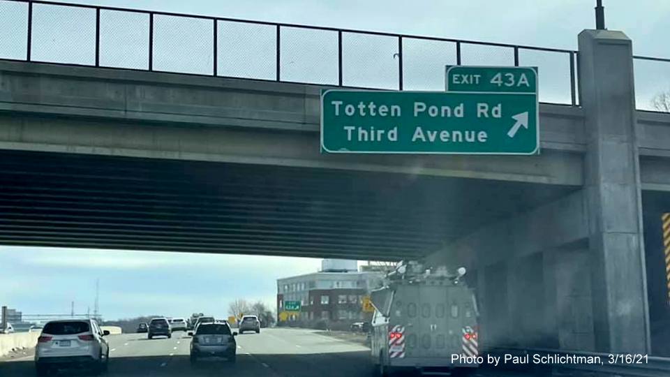 Image of overhead ramps signs for the Totten Pond Road exit with new milepost based exit number on I-95/MA 128 South in Lexington, photo by Paul Schlictman, March 2021