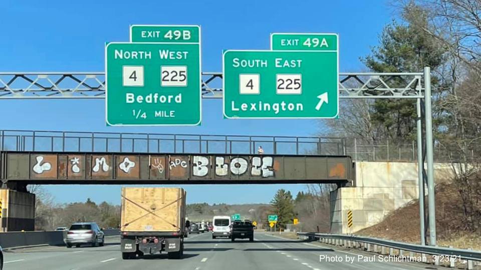 Image of overhead ramp sign for MA 4 South/MA 225 East exit with new milepost based exit number on I-95/MA 128 North in Lexington, by Paul Schlichtman, March 2021