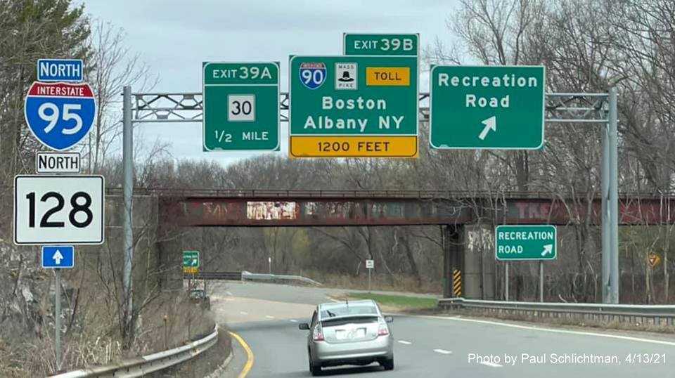 Image of advance signage for I-90/Mass Pike and MA 30 exits with new milepost based exit numbers on ramp from I-95/128 North in Newton, by Paul Schlichtman, April 2021