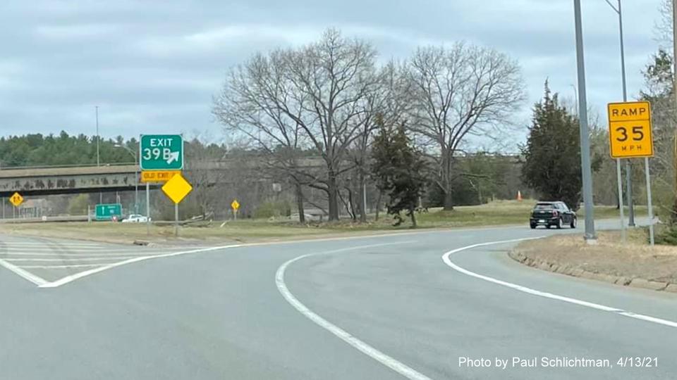 Image of gore sign for I-90/Mass Pike and MA 30 exits with new milepost based exit number on ramp from I-95/128 North in Newton, by Paul Schlichtman, April 2021