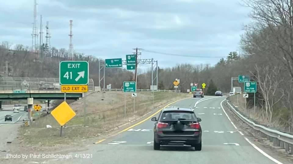 Image of gore sign for US 20 exit with new milepost based exit number and yellow Old Exit 26 advisory sign attached below on I-95/MA 128 North in Waltham, by Paul Schlichtman, April 2021