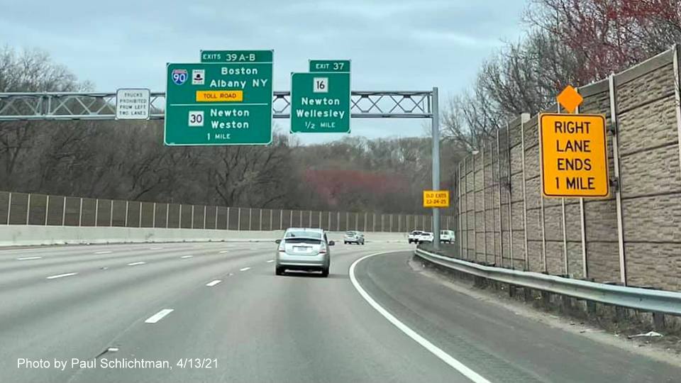 Image of 1 Mile advance sign for I-90/Mass Pike and MA 30 exits with new milepost based exit numbers and yellow Old Exits 23-24-25 sign on right support on I-95/128 North in Newton, by Paul Schlichtman, April 2021