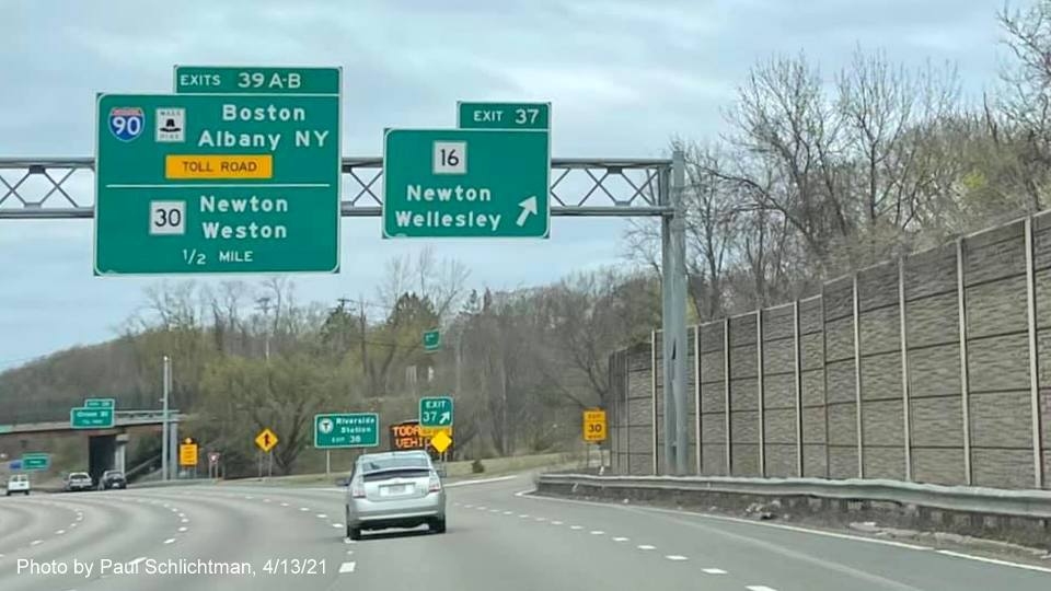 Image of 1/2 mile advance overhead signs for I-90/Mass Pike and MA 30 and MA 16 exits with new milepost based exit numbers on I-95/MA 128 North in Newton, by Paul Schlichtman, April 2021
