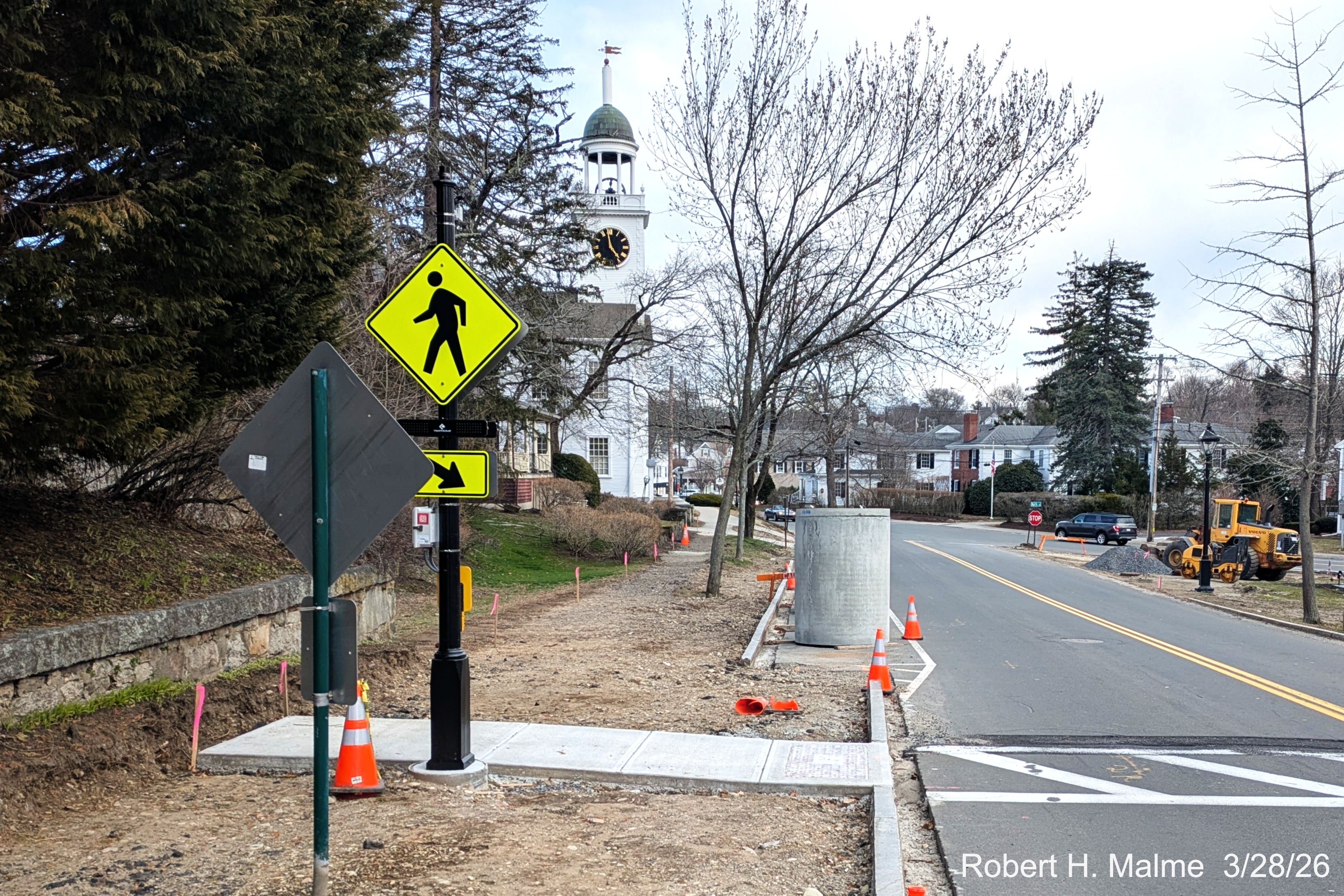 Image of cisterns awaiting placement along the east side of Lincoln Street, March 2026