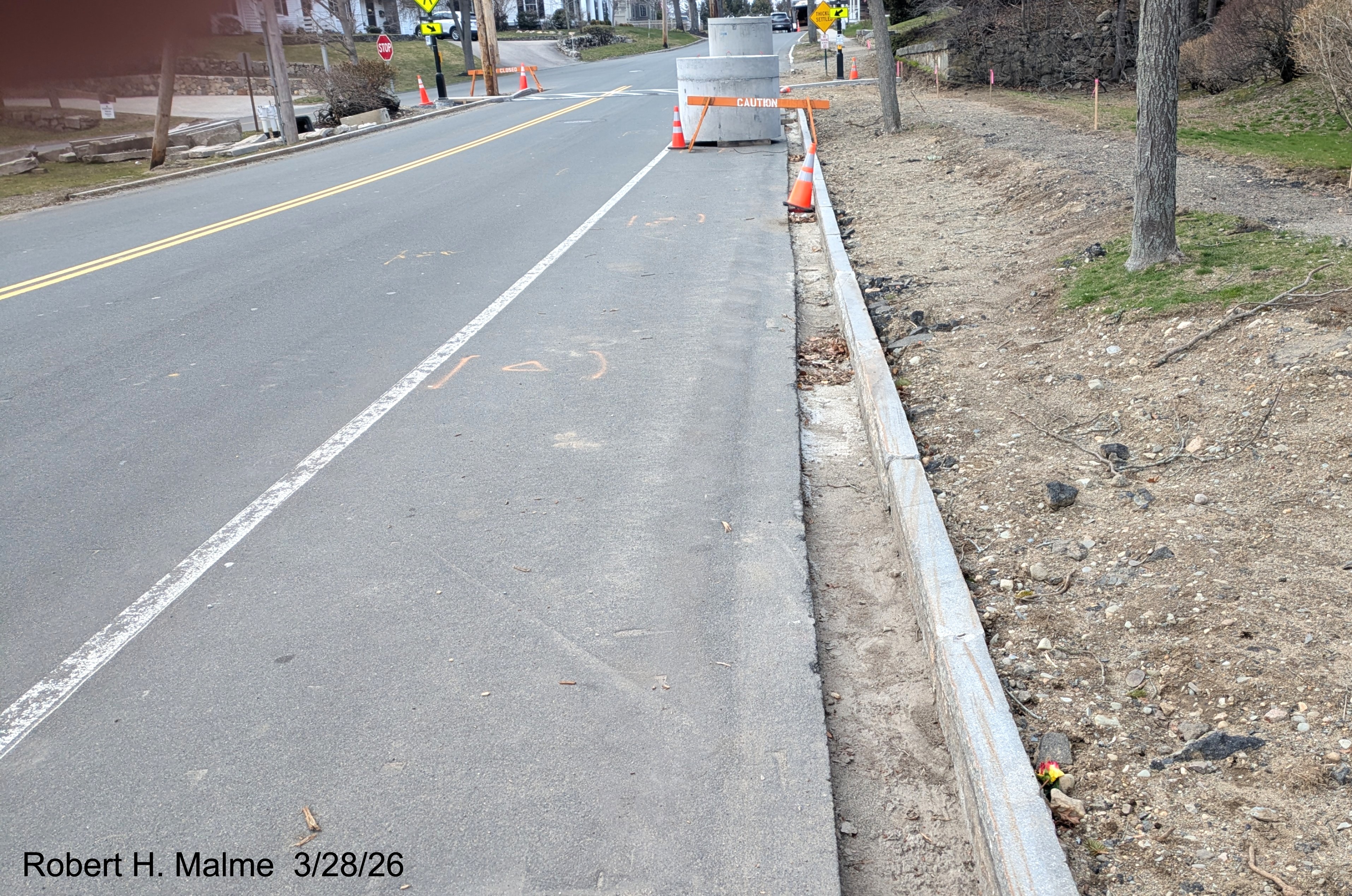 Image of second cistern and completed curbing along the east side of Lincoln Street, 
	March 2026
