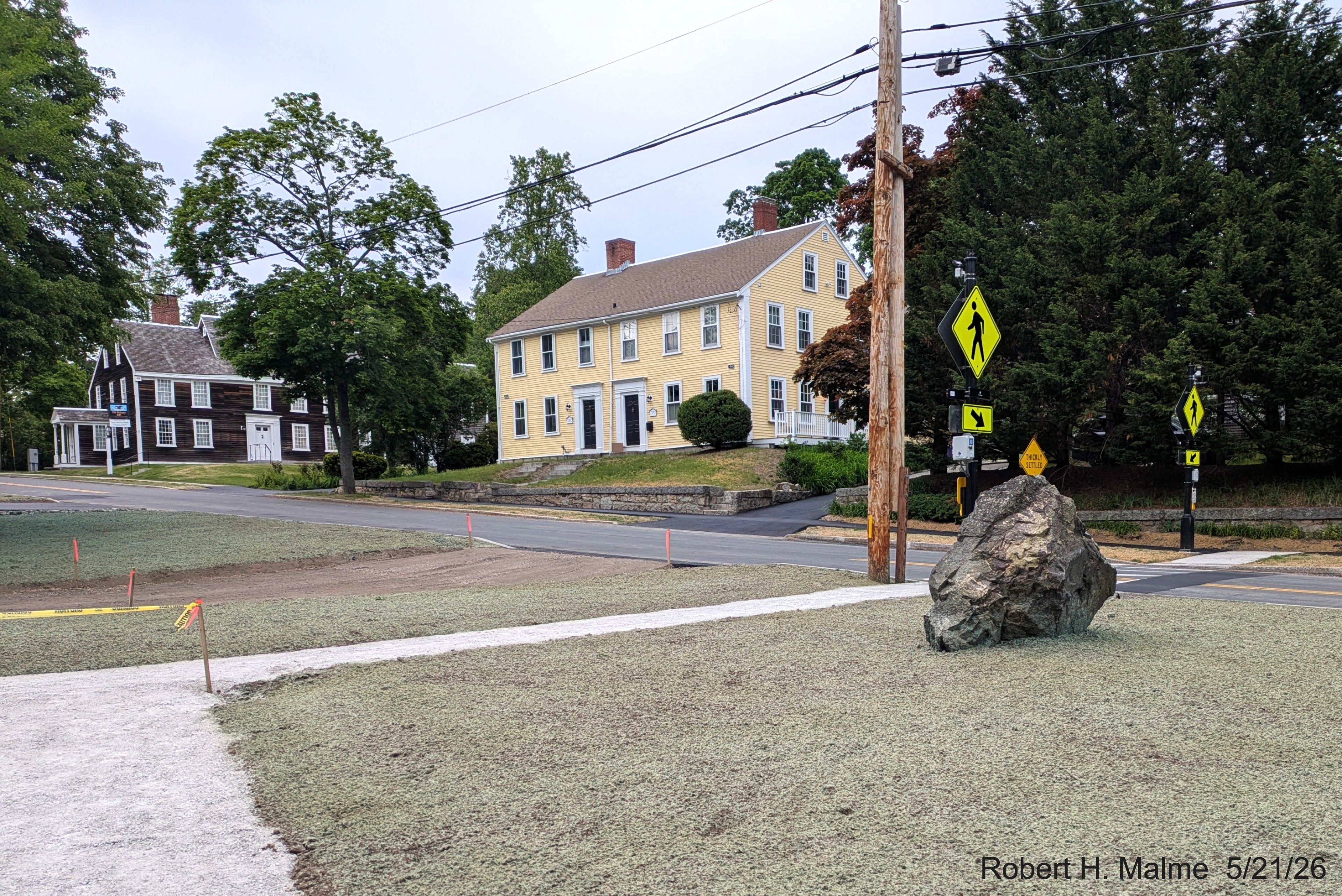 Image looking up the new walkway towards the Benjamin Lincoln House driveway and Lincoln
	Street with landscaping nearly completed, May 2026