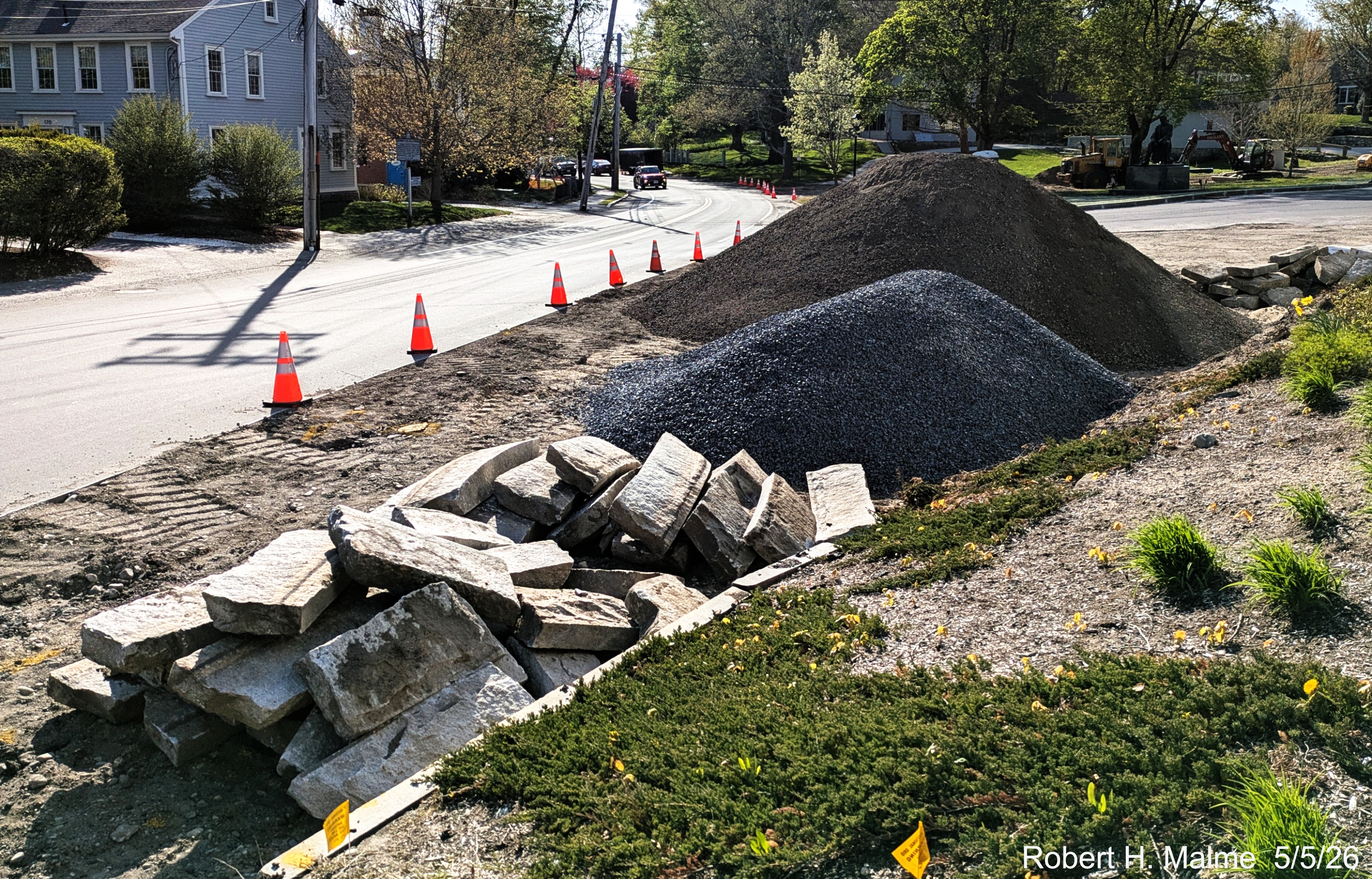 Image of gravel and dirt piles at the intersection of North and Lincoln Streets as part
	of the landscaping work, May 2026