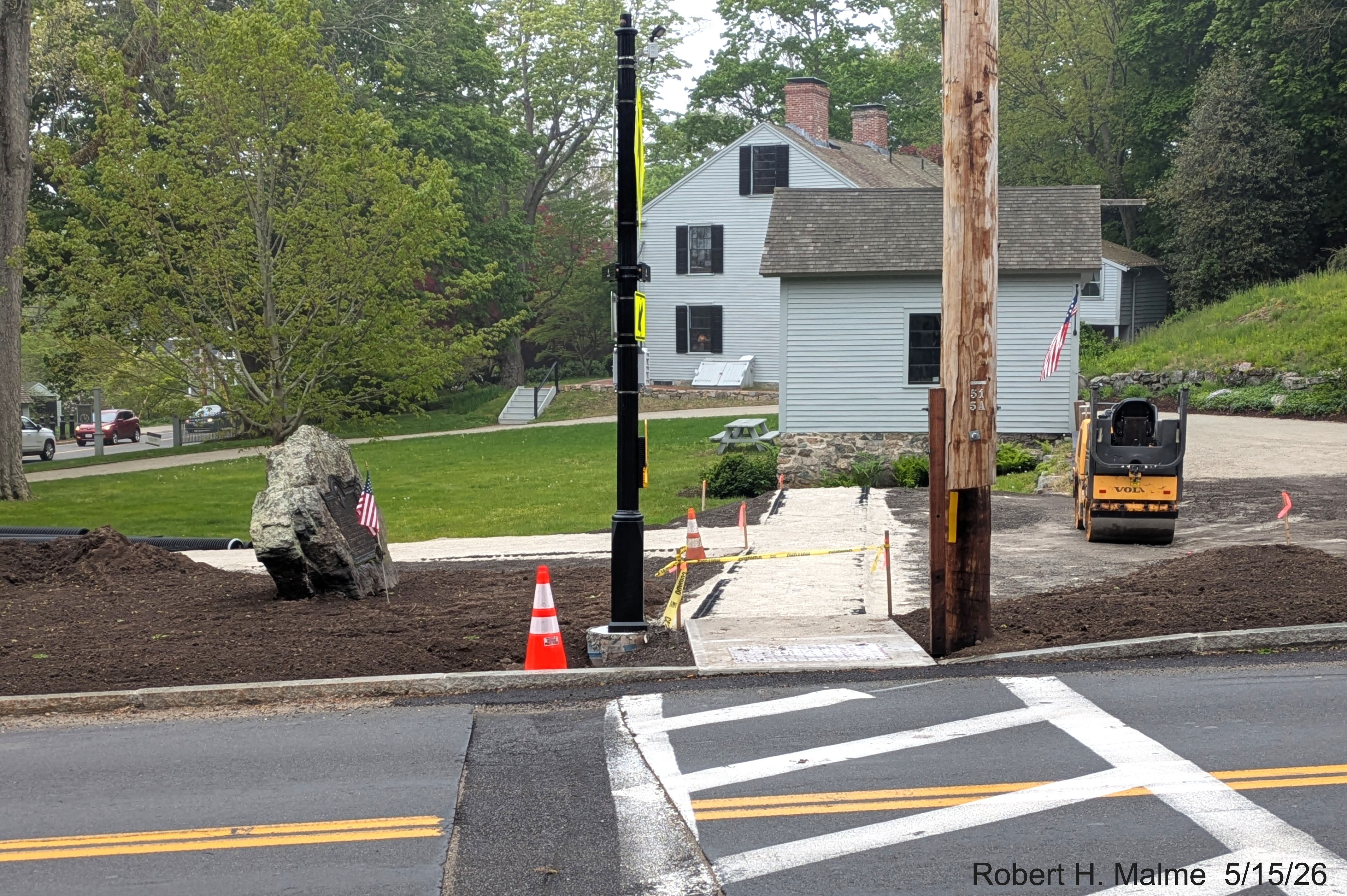 Image looking across Lincoln Street at initial construction of multiple use walkway 
	starting after pedestrian crossing, May 2026