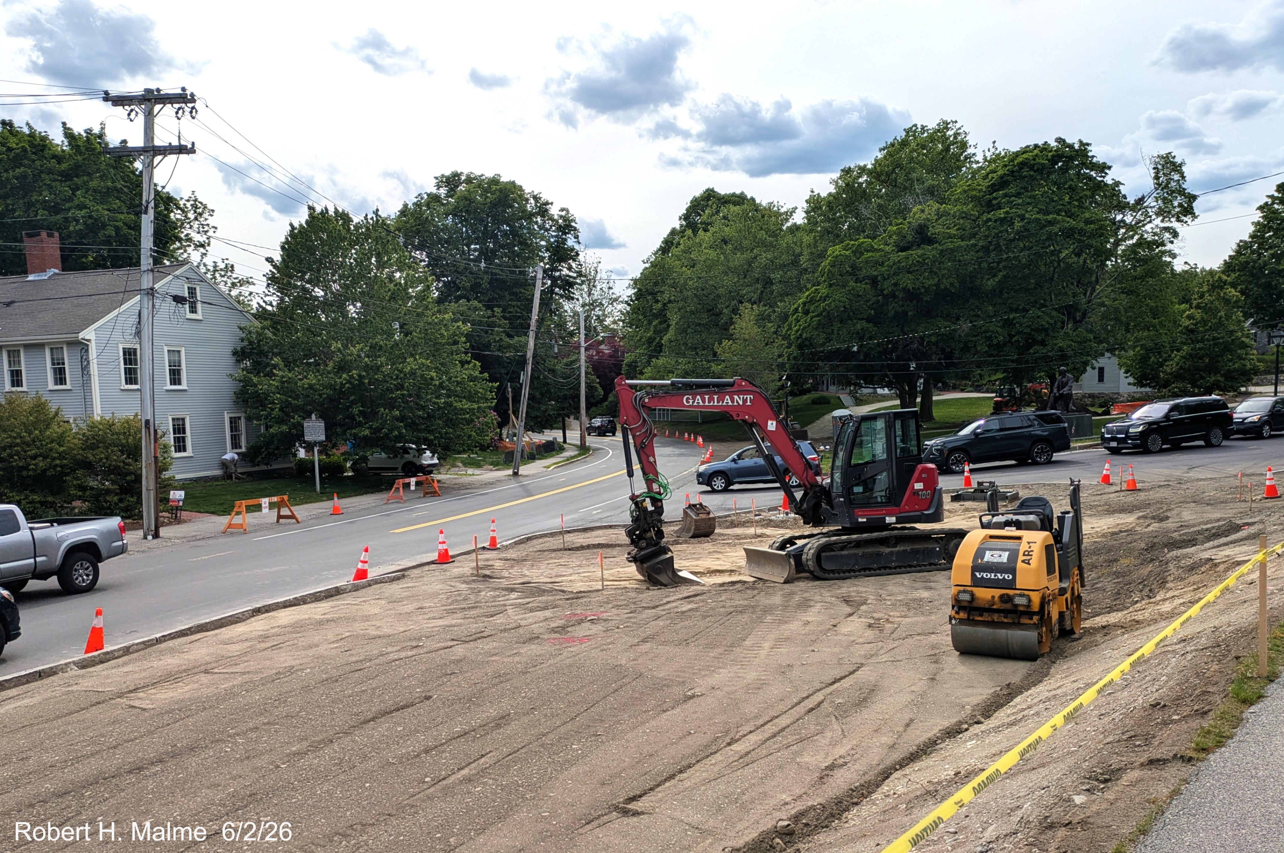 Image of taken from in front of New North Church showing landscape work near completion
	with soil being graded, June 2026