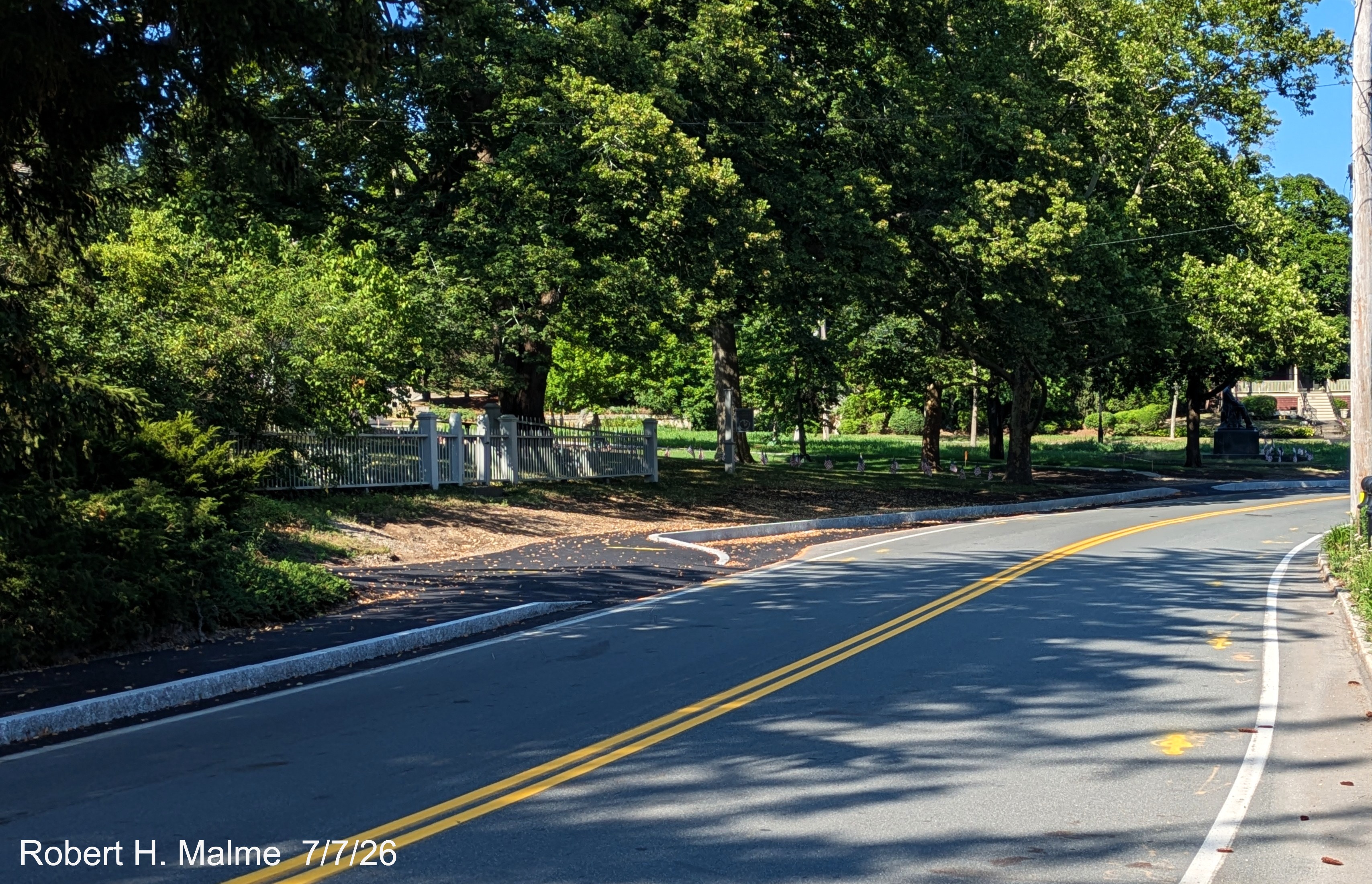 Image taken looking east along North Street along the newly paved sidewalk in front of
	the Benjamin Lincoln House, July 2026