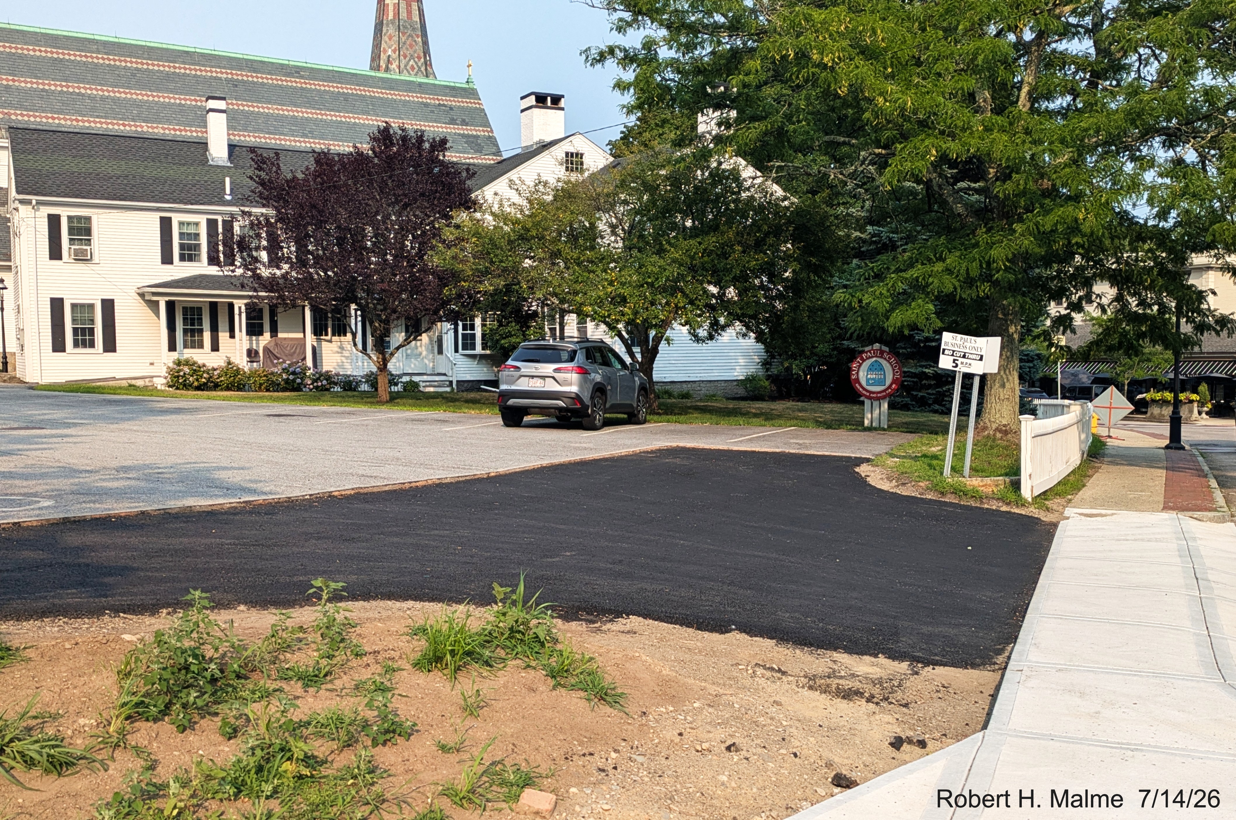 Image taken of completed paving excavated section of St. Paul's School parking lot
	along North Street, July 2026