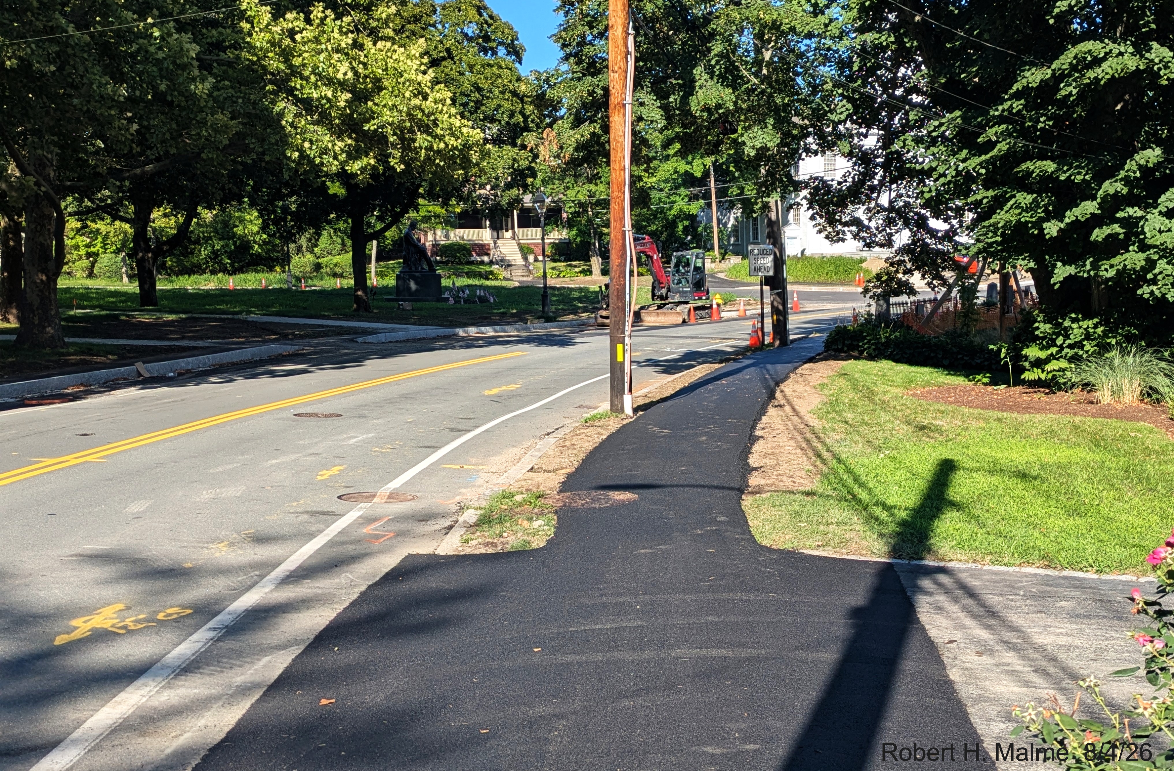 Image taken looking at pavement placed along improved sidewalk on North Street across
	from the Benjamin Lincoln House, August 2026