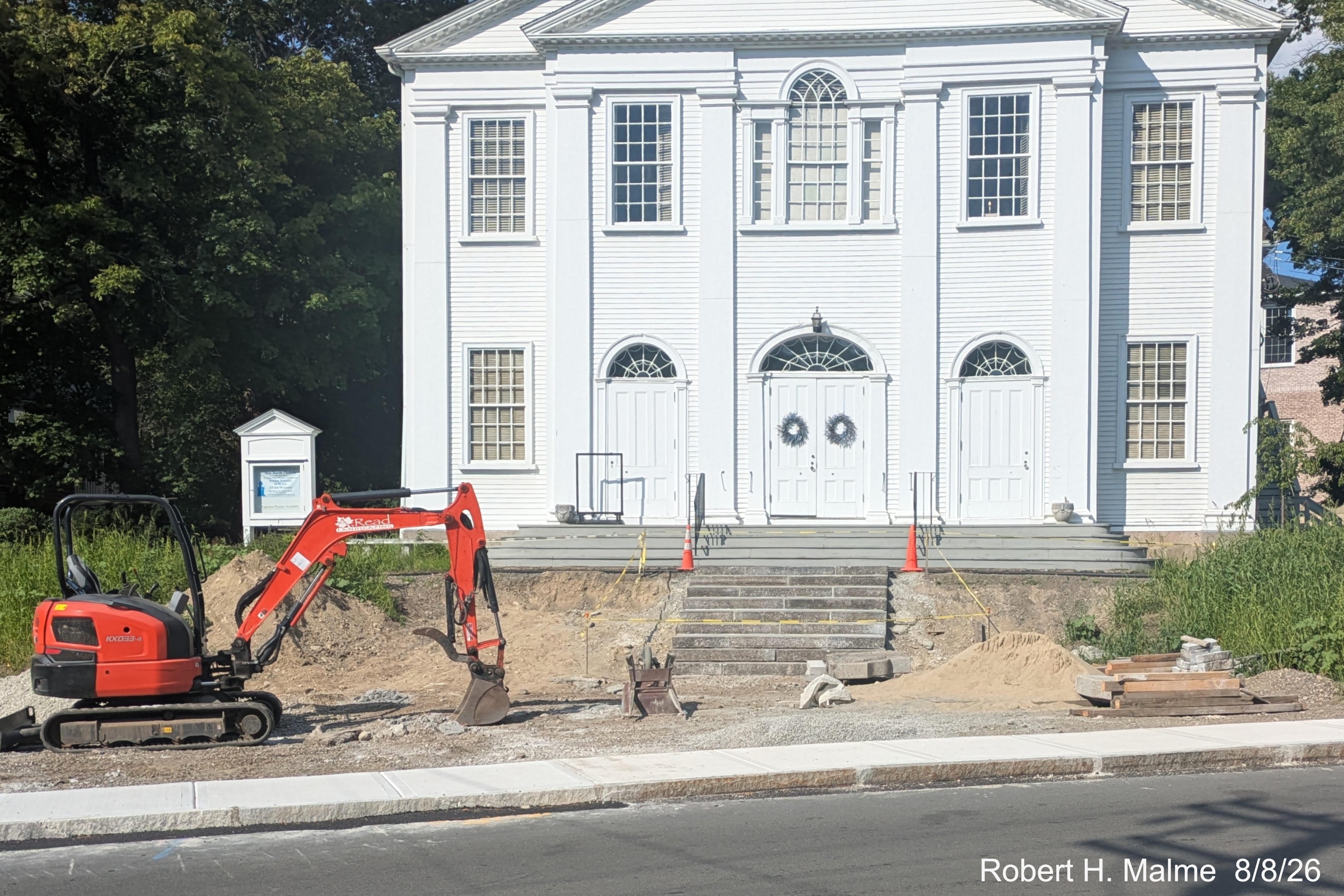 Image taken looking across North Street at nearly completed stone stairway in front of
	New North Church, August 2026