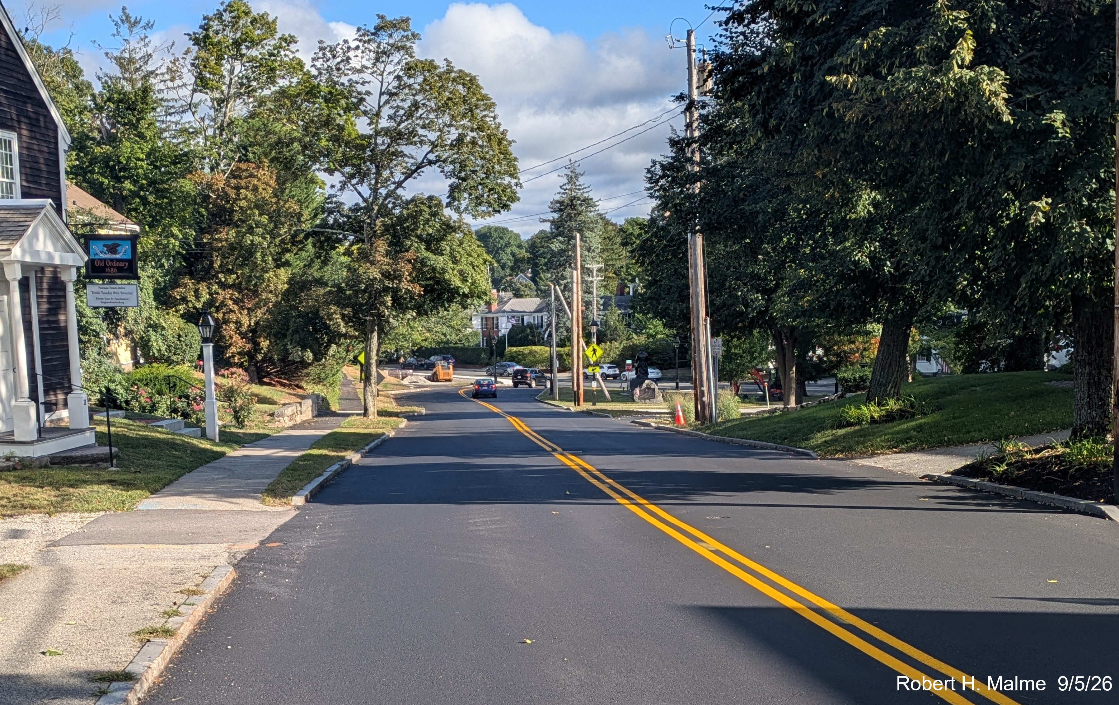 Image taken looking south along Lincoln Street from the Old Ordinary showing the placement 
	of yellow lane markings a week after final paving, September 2026