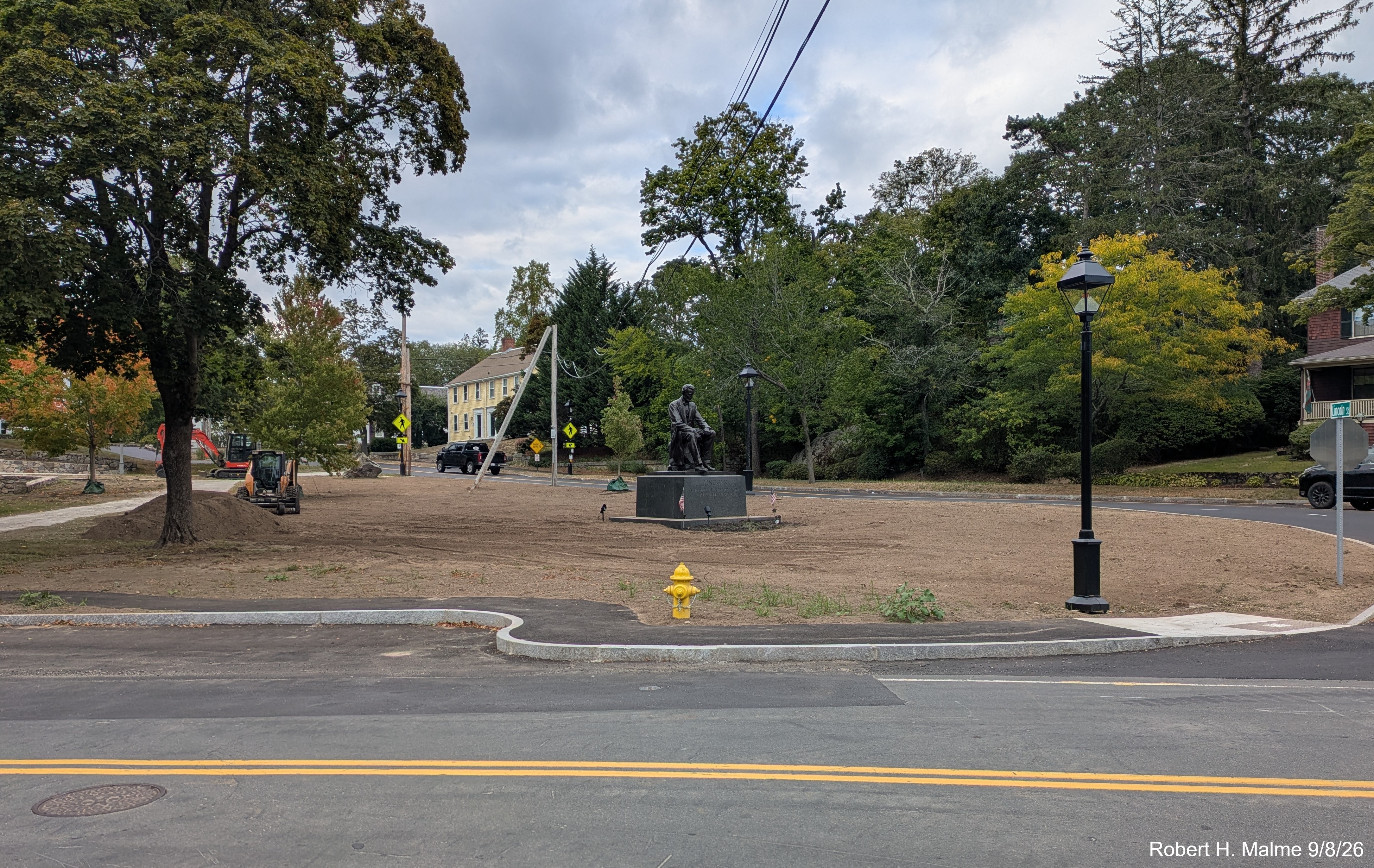 Image taken from North Street looking across the street showing the work to 
	finalize the landscaping in Fountain Square after the final paving, September 2026