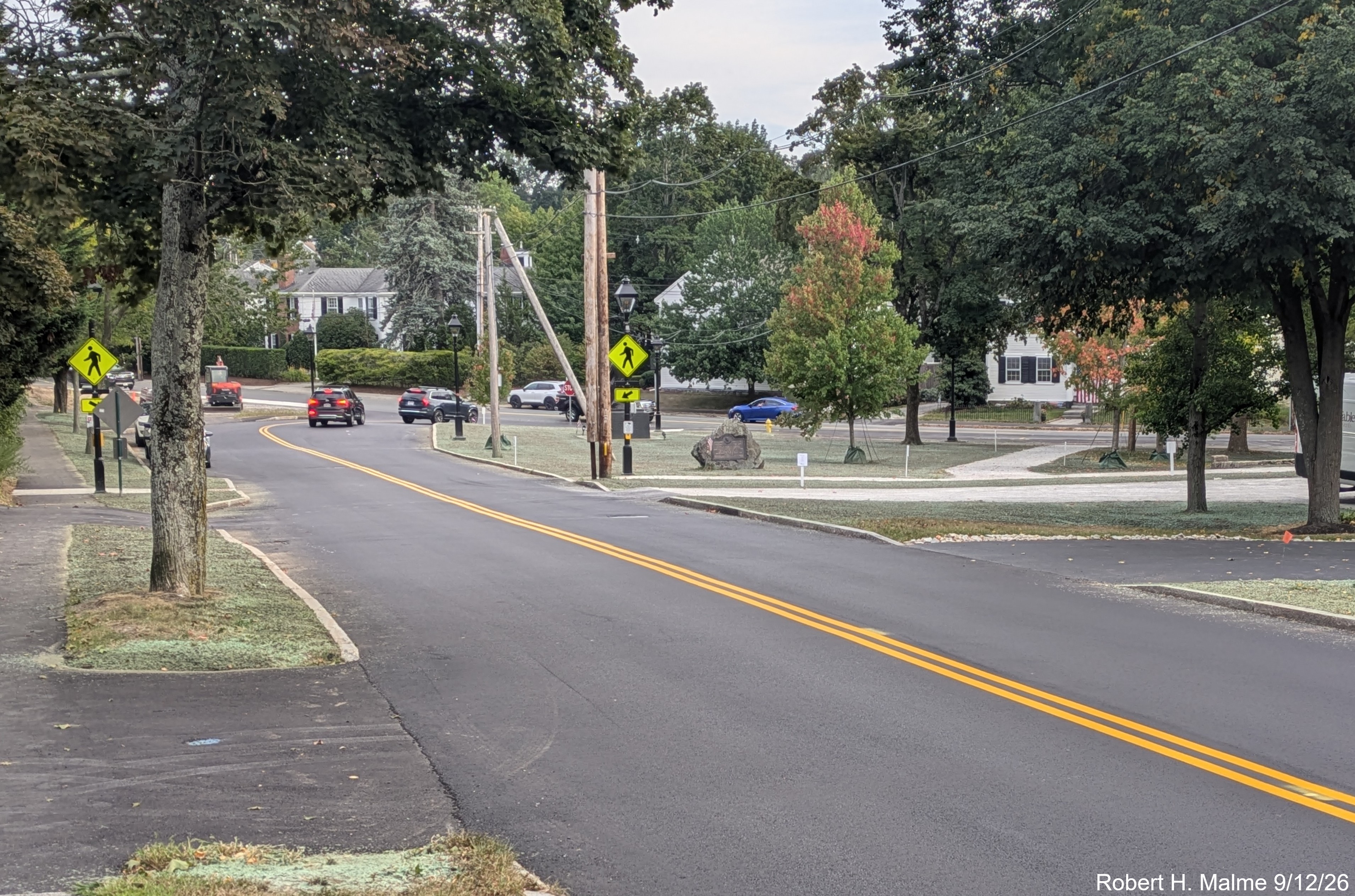 Image taken from Lincoln Street showign reseeding has taken place on Fountain Square 
	lawn while awaiting the final lane striping, September 2026