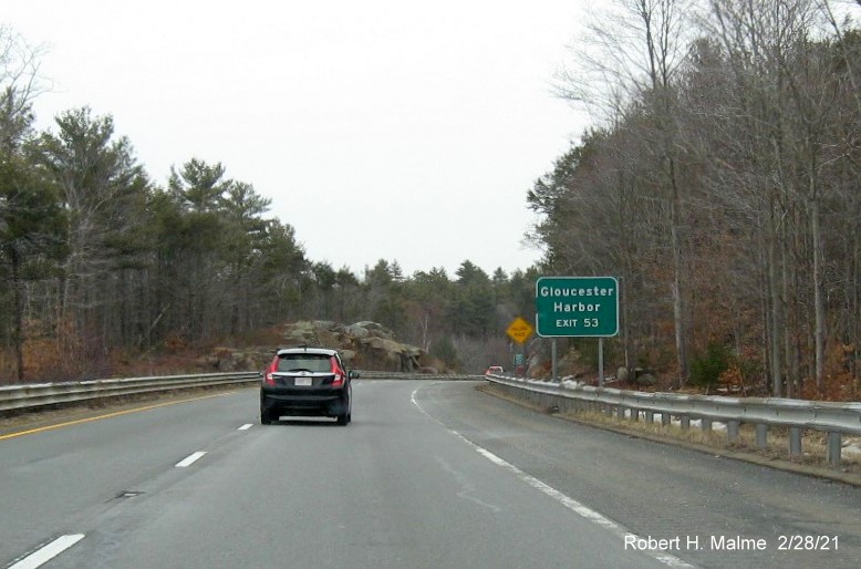 Image of auxiliary sign for MA 133 exit with new milepost based exit number on MA 128 North in Gloucester, February 2021