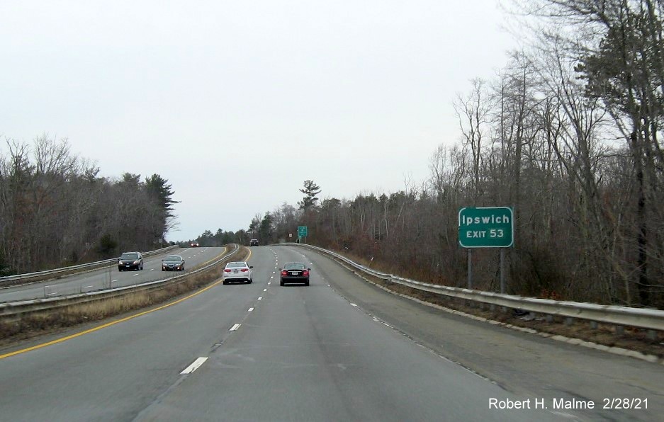 Image of auxiliary sign for MA 133 exit with new milepost based exit number on MA 128 South in Gloucester, February 2021