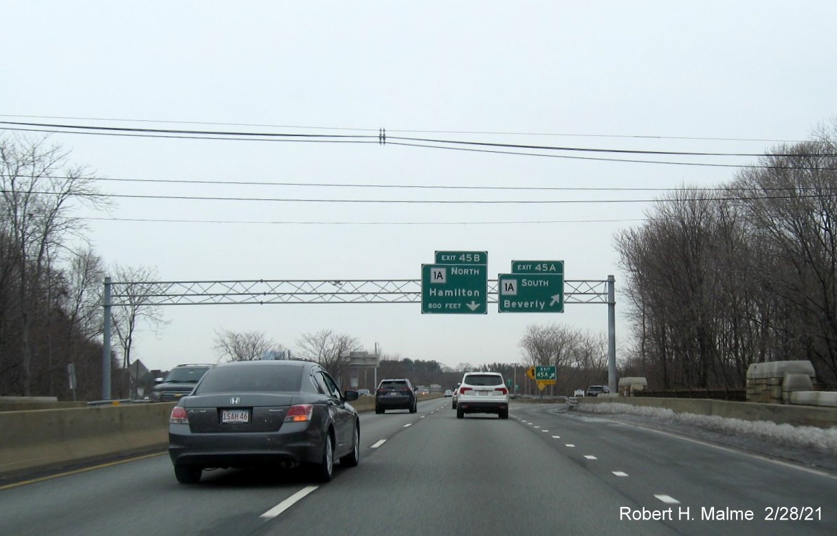 Image of overhead ramp signs for MA 1A exits with new milepost based exit numbers on MA 128 North in Beverly, February 2021