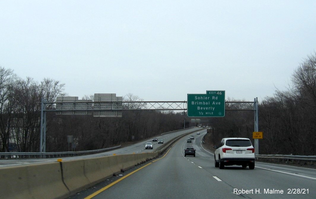 Image of 1/2 mile advance sign for Sohier Road exit with new milepost based exit number and yellow old exit number sign on support post on MA 128 North in Beverly, February 2021