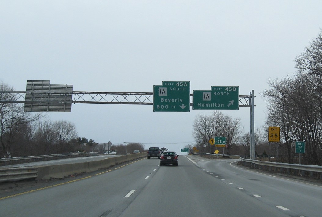 Image of overhead ramp signs at MA 1A North exit with new milepost based exit numbers on MA 128 South in Beverly, February 2021