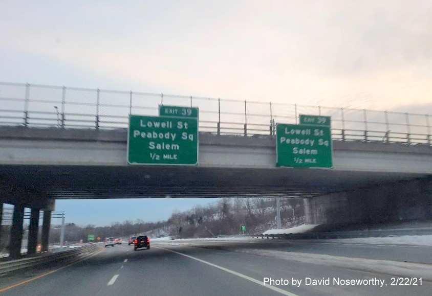 Image of pair of 1/2 mile advance signs for Lowell Street exit with new milepost based exit numbers on MA 128 North in Peabody, by David Noseworthy, February 2021