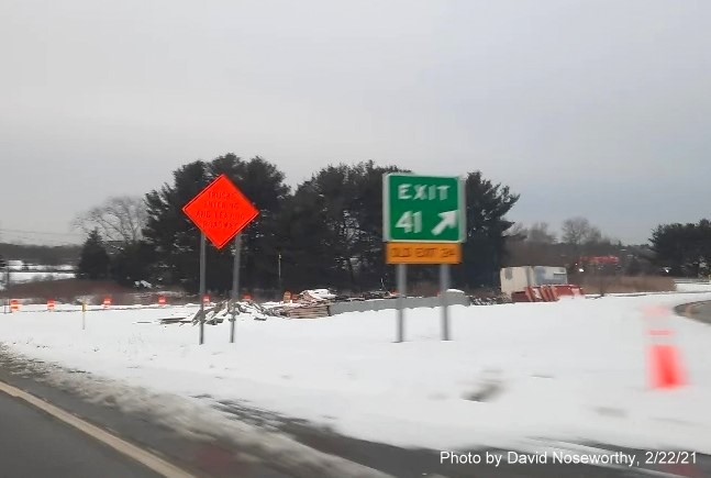 Image of gore sign for the Endicott Street exit with new milepost 
      based exit number and yellow old exit sign on the right support post on MA 128 South in Danvers, February 2021