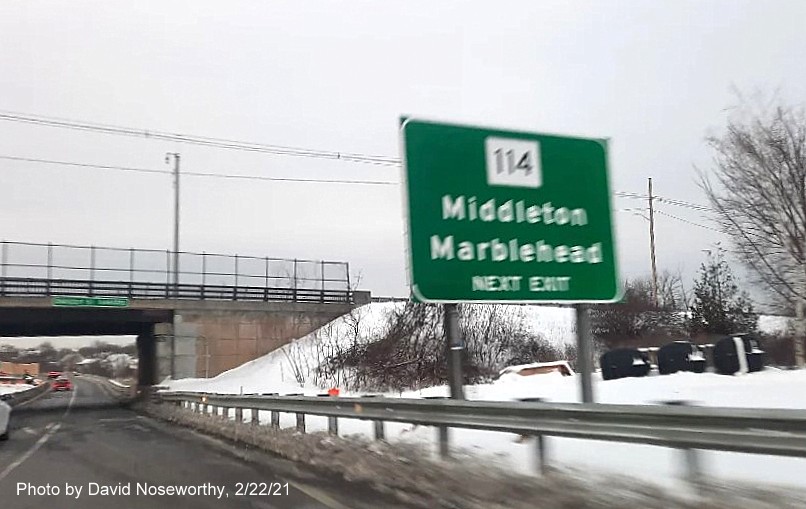 Image of ground mounted 1/2 mile advance sign for MA 114 exits without tab for new milepost based exit number on MA 128 South in Peabody, photo by David Noseworthy, February 2021