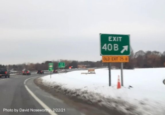 Image of gore sign for MA 114 West exit with new milepost based exit number and yellow old exit number sign below on MA 128 South in Peabody, photo by David Noseworthy, February 2021