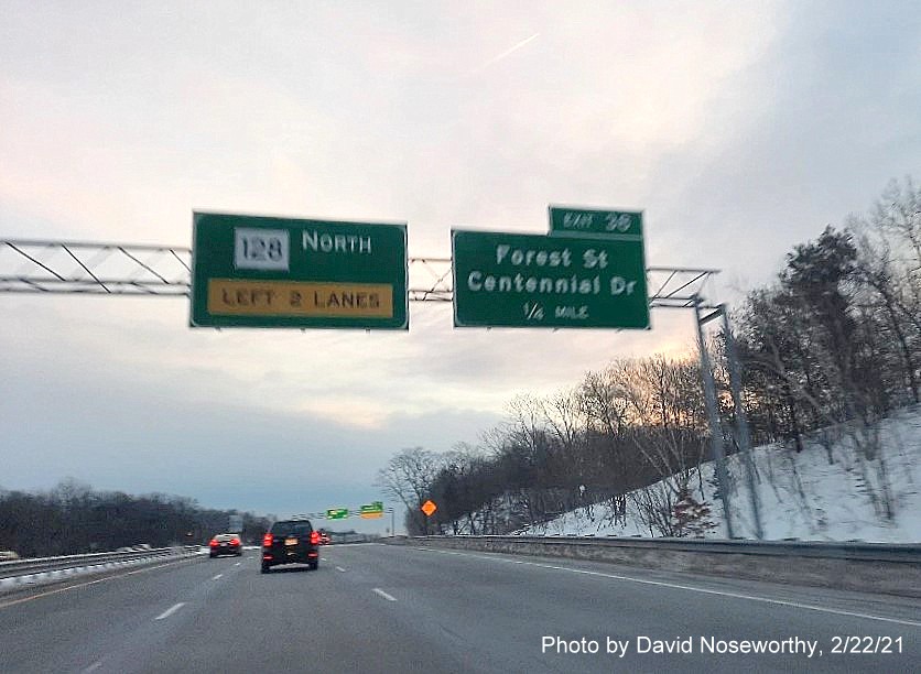 Image of 1/2 mile advance overhead sign for Centennial Drive exit with new milepost based number on MA 128 North in Peabody, by David Noseworthy, February 2021