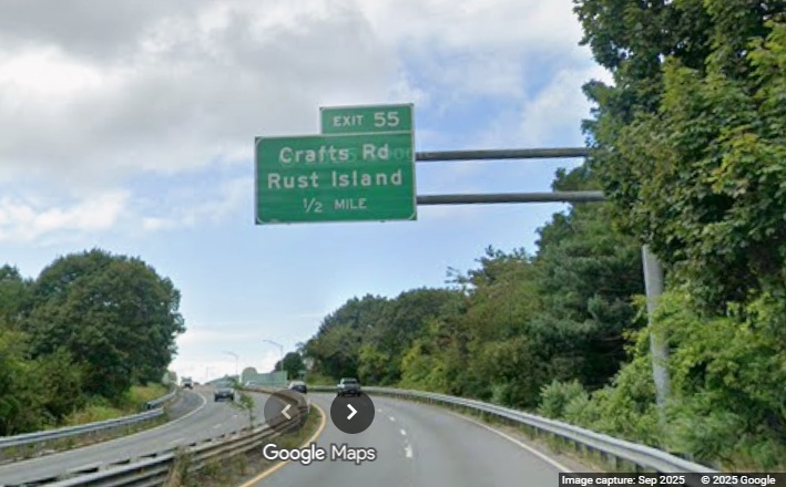 Image of new 1/2 Mile advance overhead sign for Crafts Road exit on MA 128 South in 
	Gloucester, Google Maps Street View, September 2025